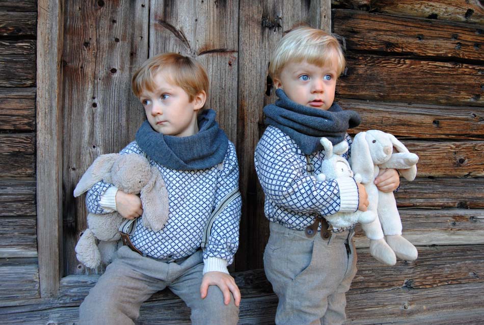 two small boys holding their stuffed animals