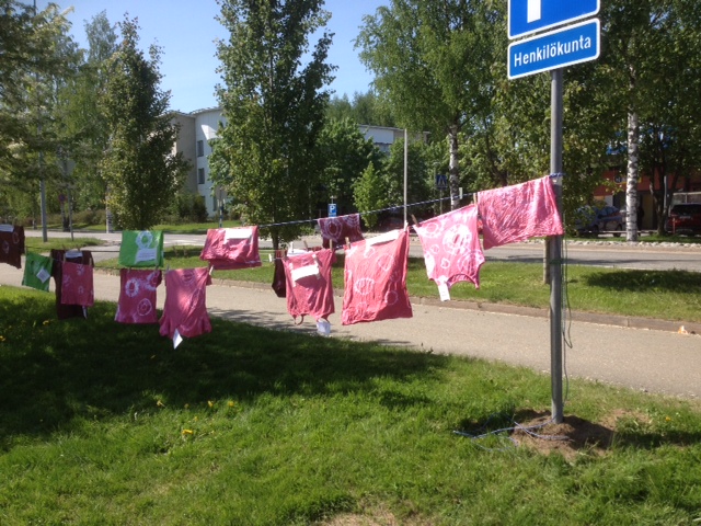 a picture of clothes hung to dry with a sign pool 